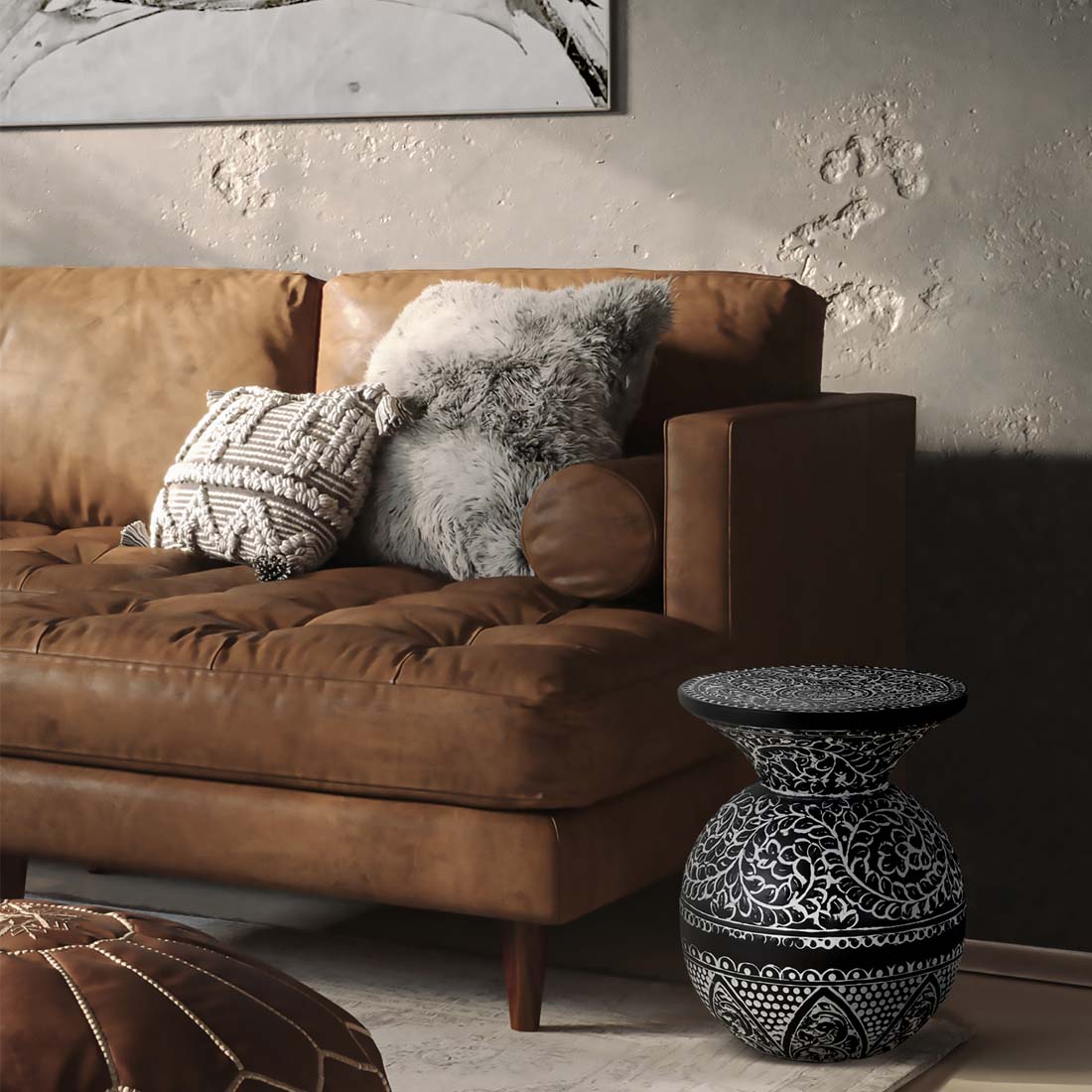 Load video: video showing an etched black and white side table beside a light brown leather sofa