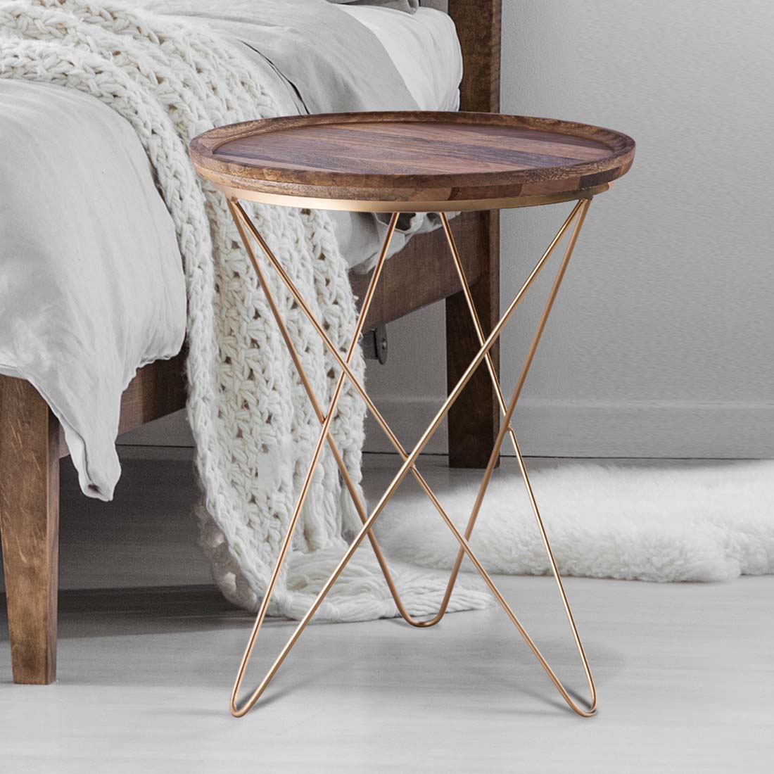 Load video: video showing details of a side table with a wooden top, and gold legs that cris cross